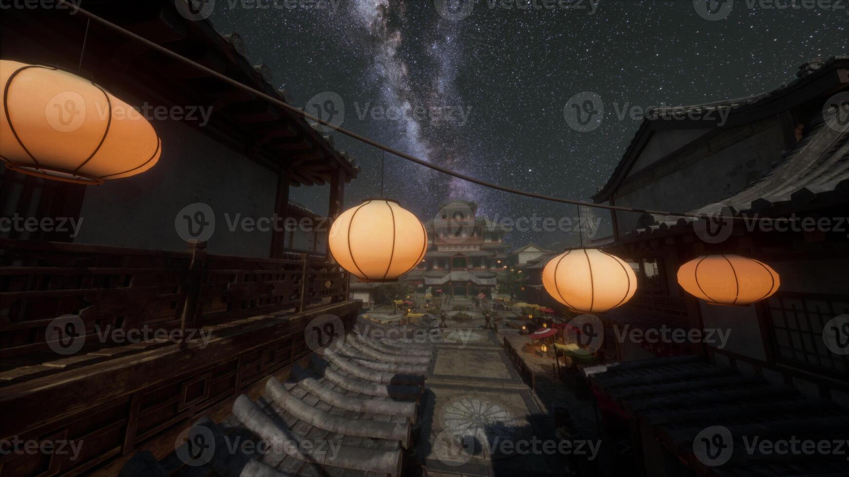 A group of lanterns hanging from a line under a night sky photo