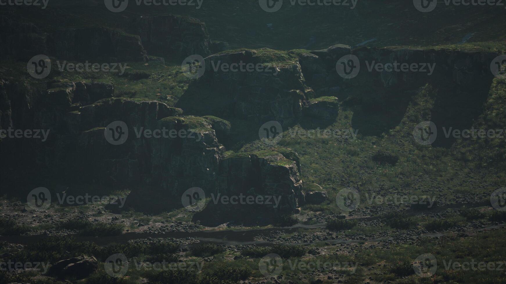 A group of large rocks in the middle of a field photo