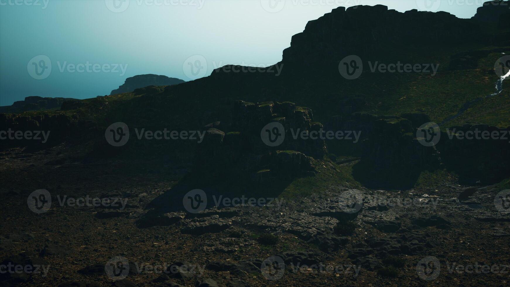A large rock formation in the middle of a desert photo