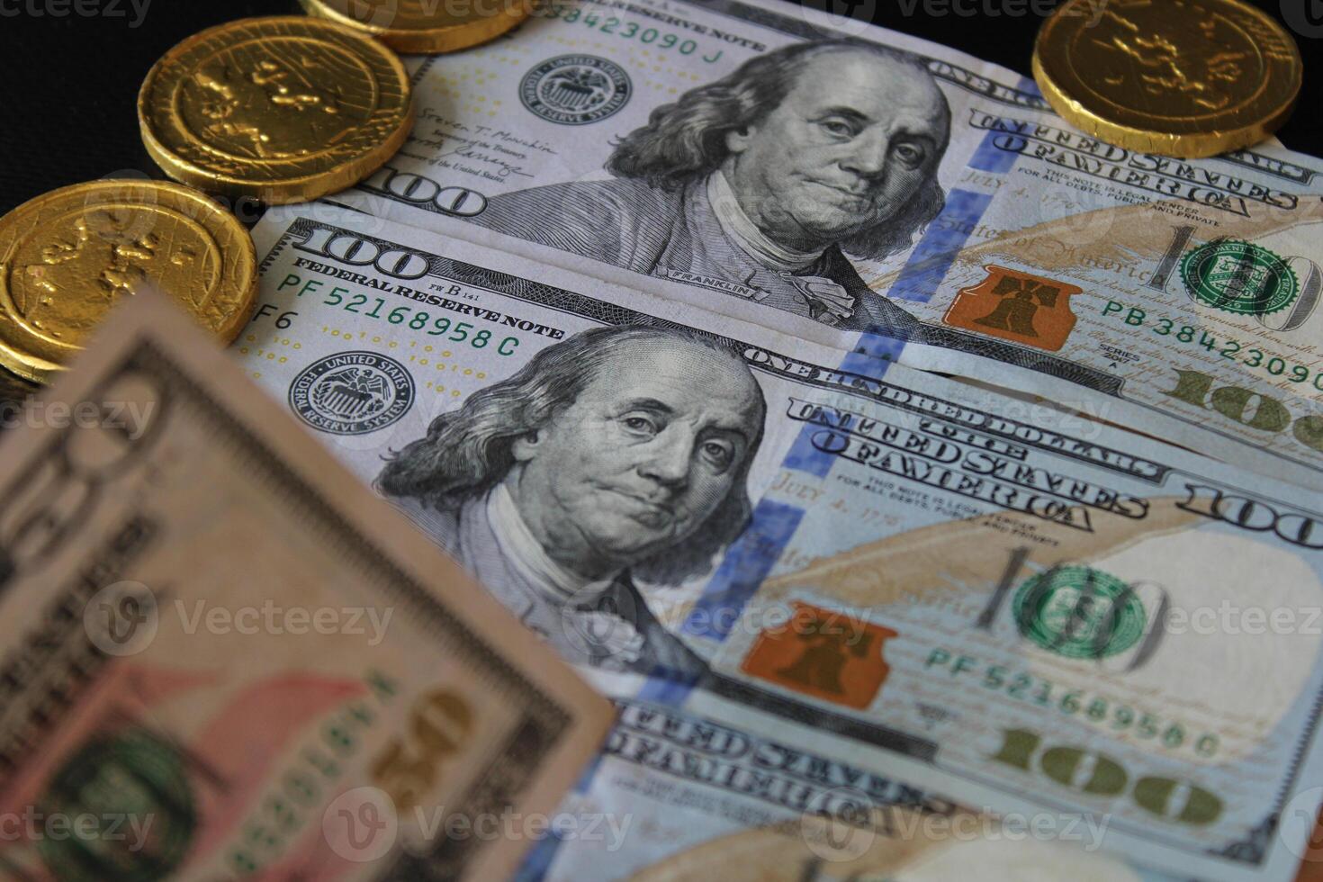 A stack of dollar bills with the word United States written on it. Finance and economics. 100 American dollars. photo