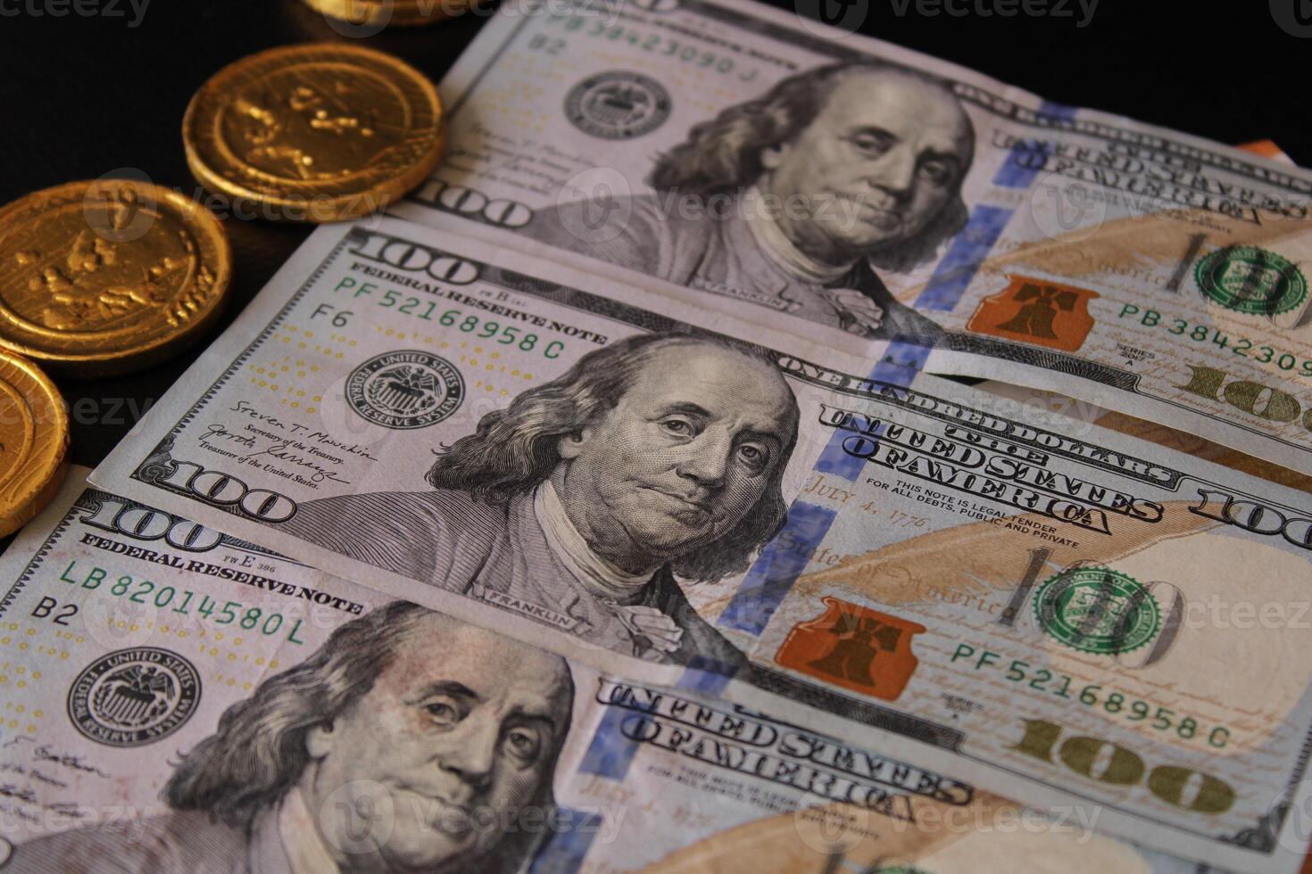 A stack of dollar bills with the word United States written on it. Finance and economics. 100 American dollars. photo