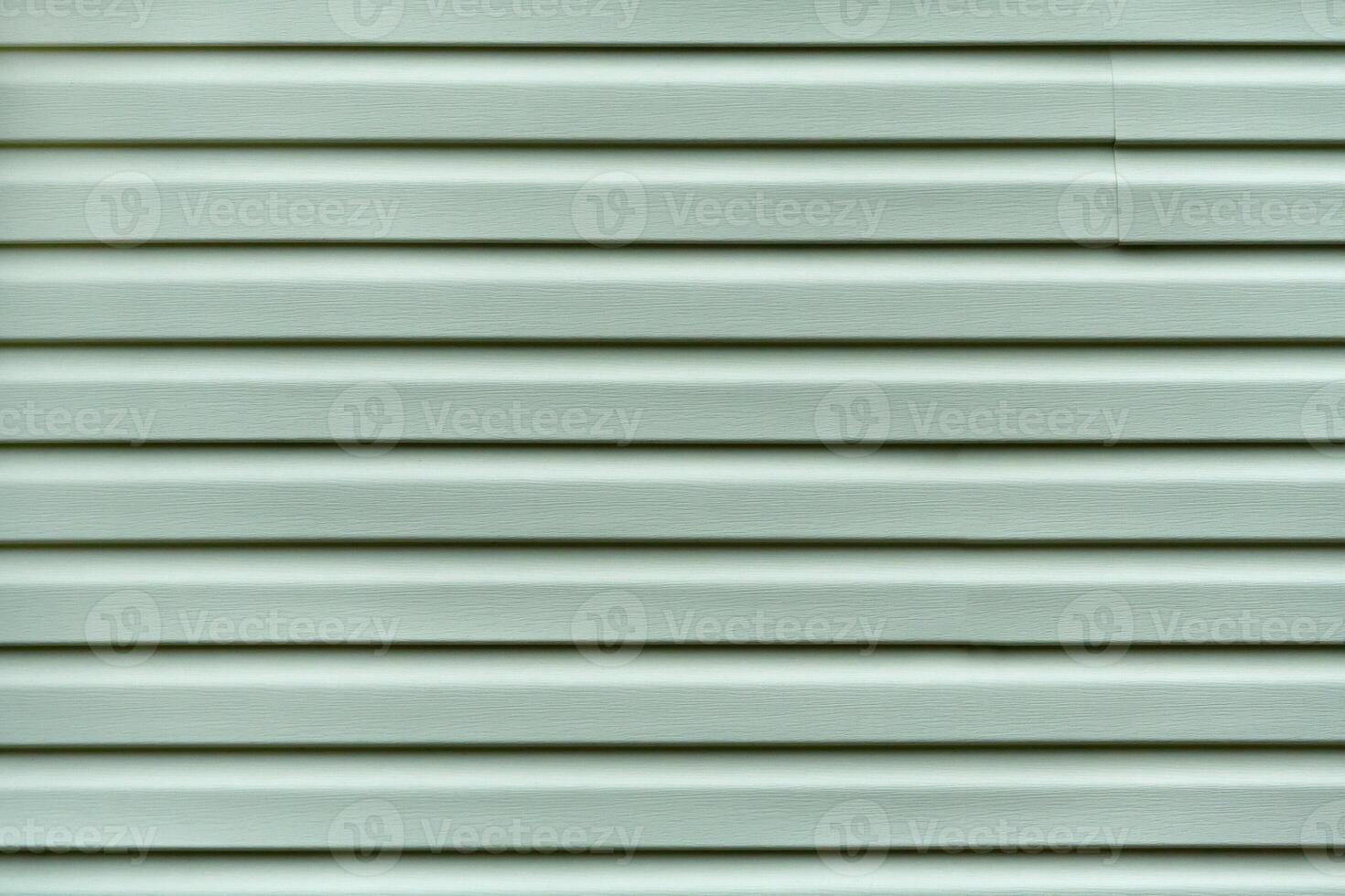 Metallic rippled surface as texture, background photo