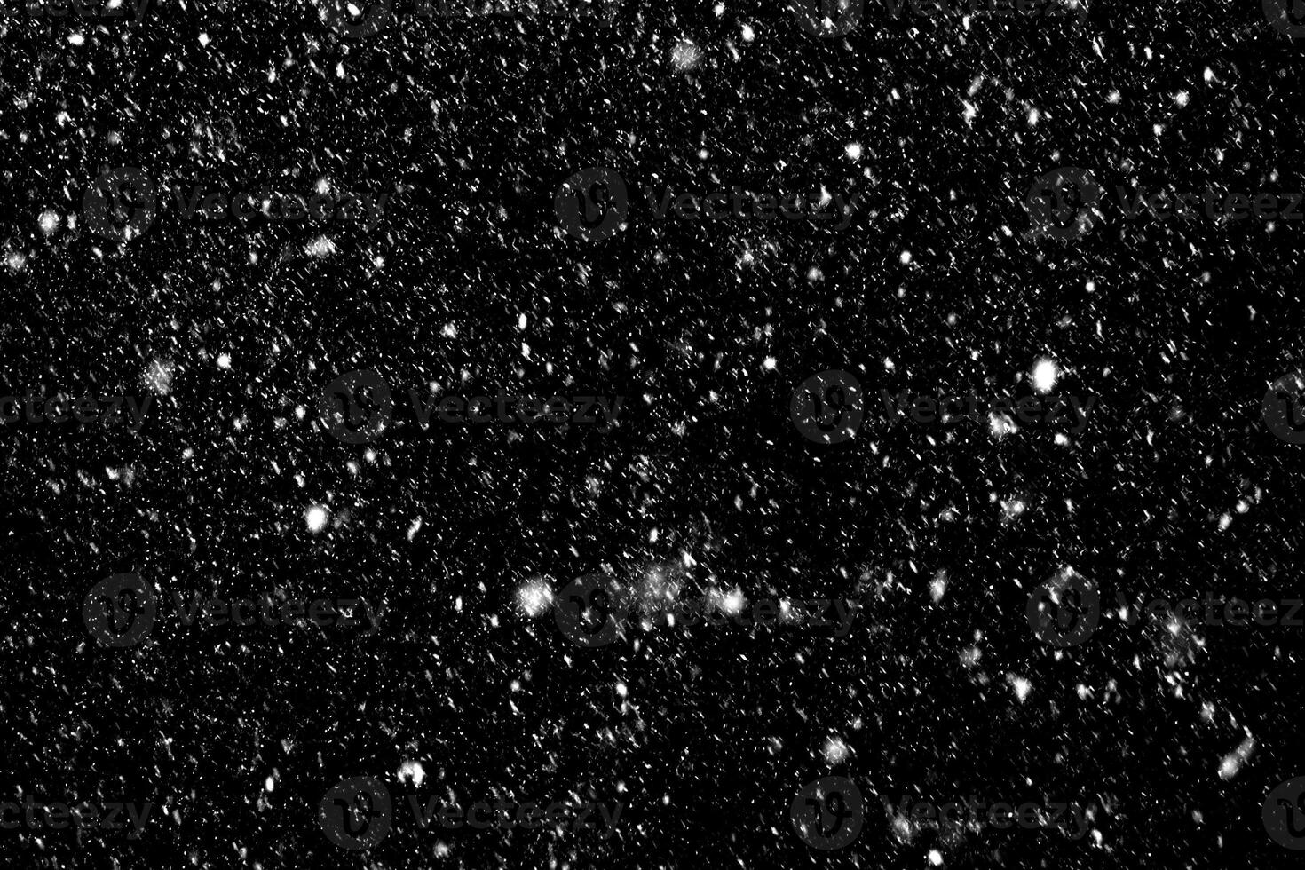 Snow on black background photo