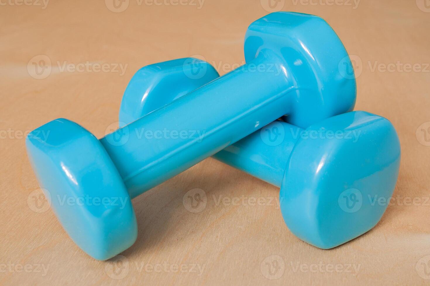dumbbells on a wooden floor photo