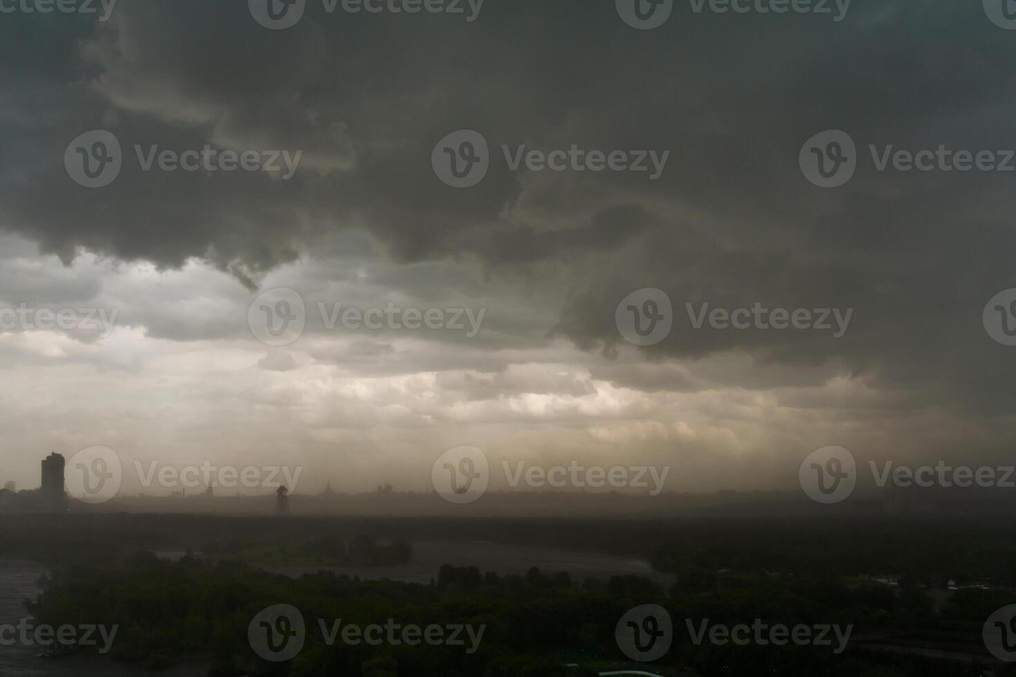 Overcast sky and storm clouds over the city photo