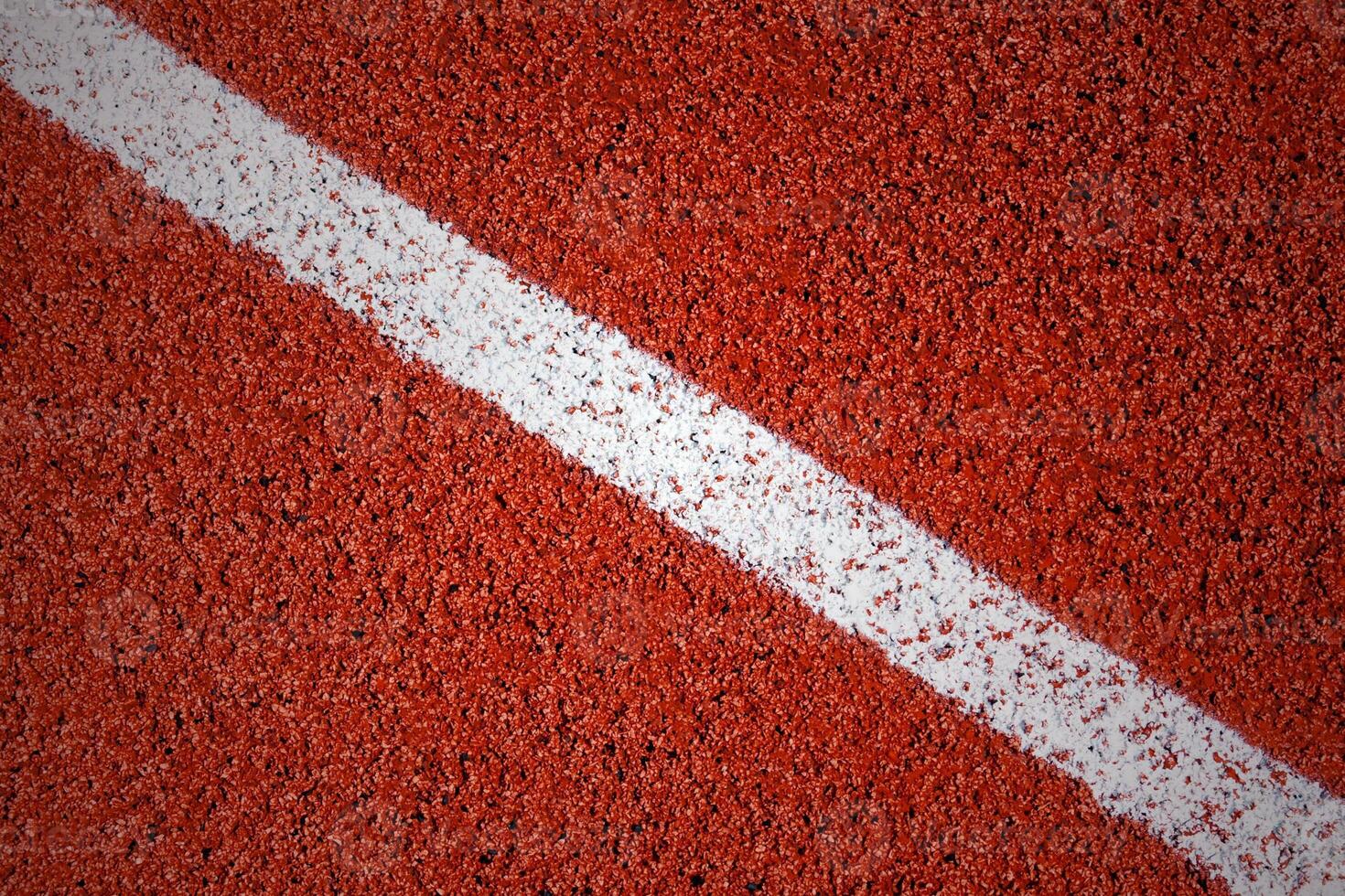 White line on a surface of running track texture, background, vignette photo