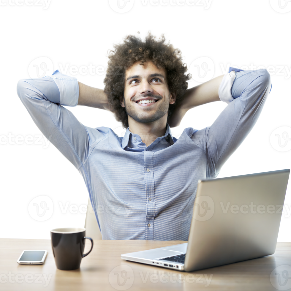 A cheerful man sits back with hands behind his head, smiling next to a laptop and coffee cup on a wooden desk png