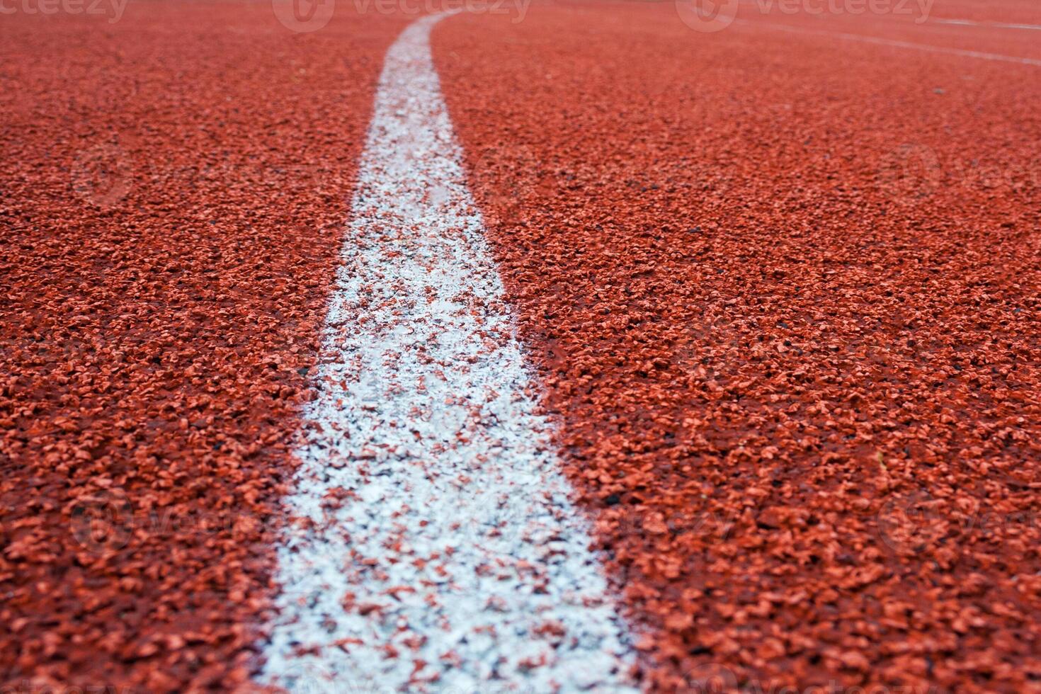 White line on a surface of running track as background photo