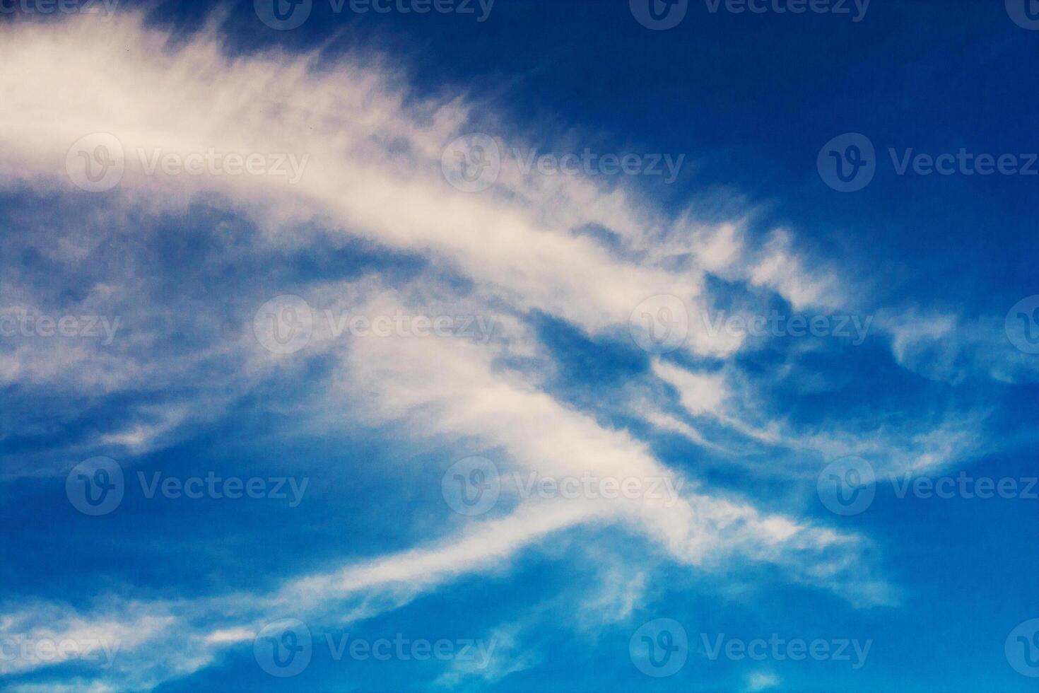 Clouds in the sunlight against the blue sky photo