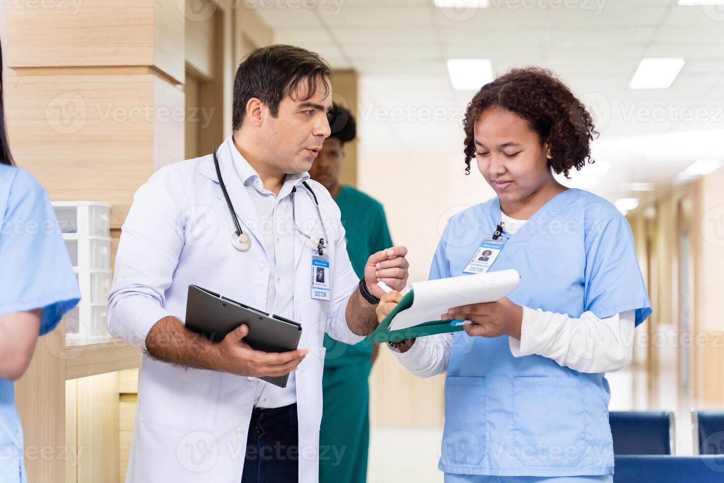 Team of diversity doctor and nurse is discussing and brainstorming on patient medical record after diagnosis for precise care plan with experienced senior physician specialist photo