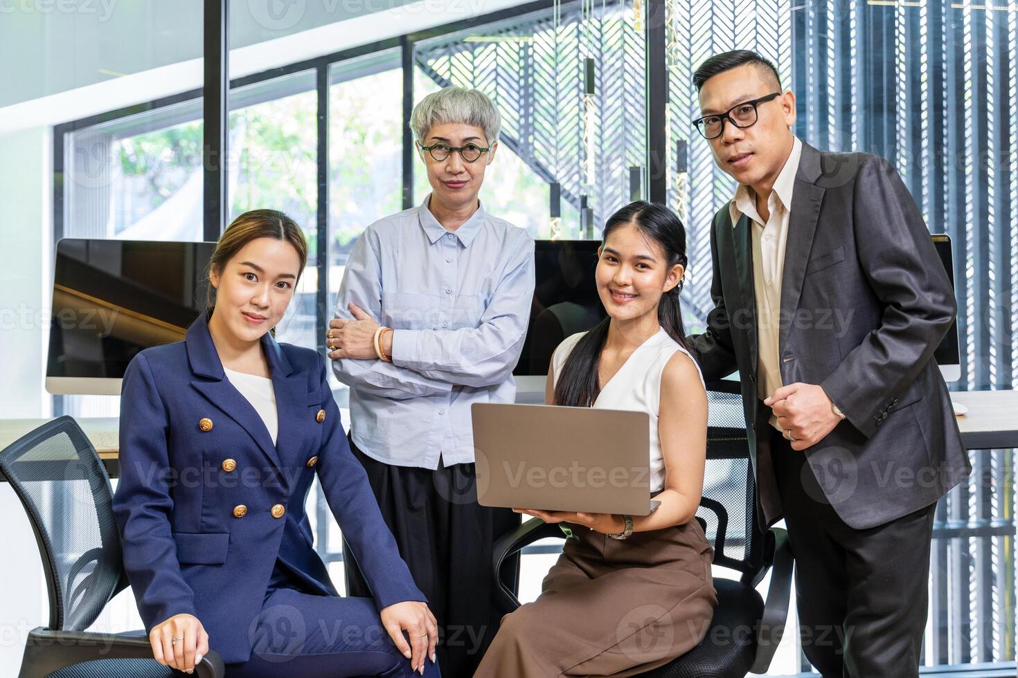 Group portrait of Asian business people team in formal suit from different ages that represent mix skill and knowledge concept photo