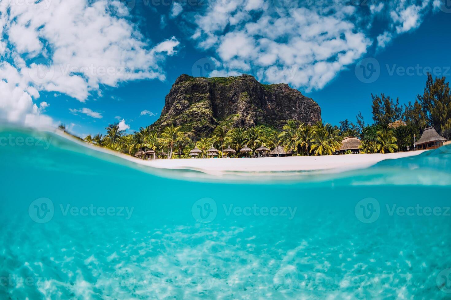 Tropical transparent ocean with Le Morne mountain and luxury beach in Mauritius. Split view. photo