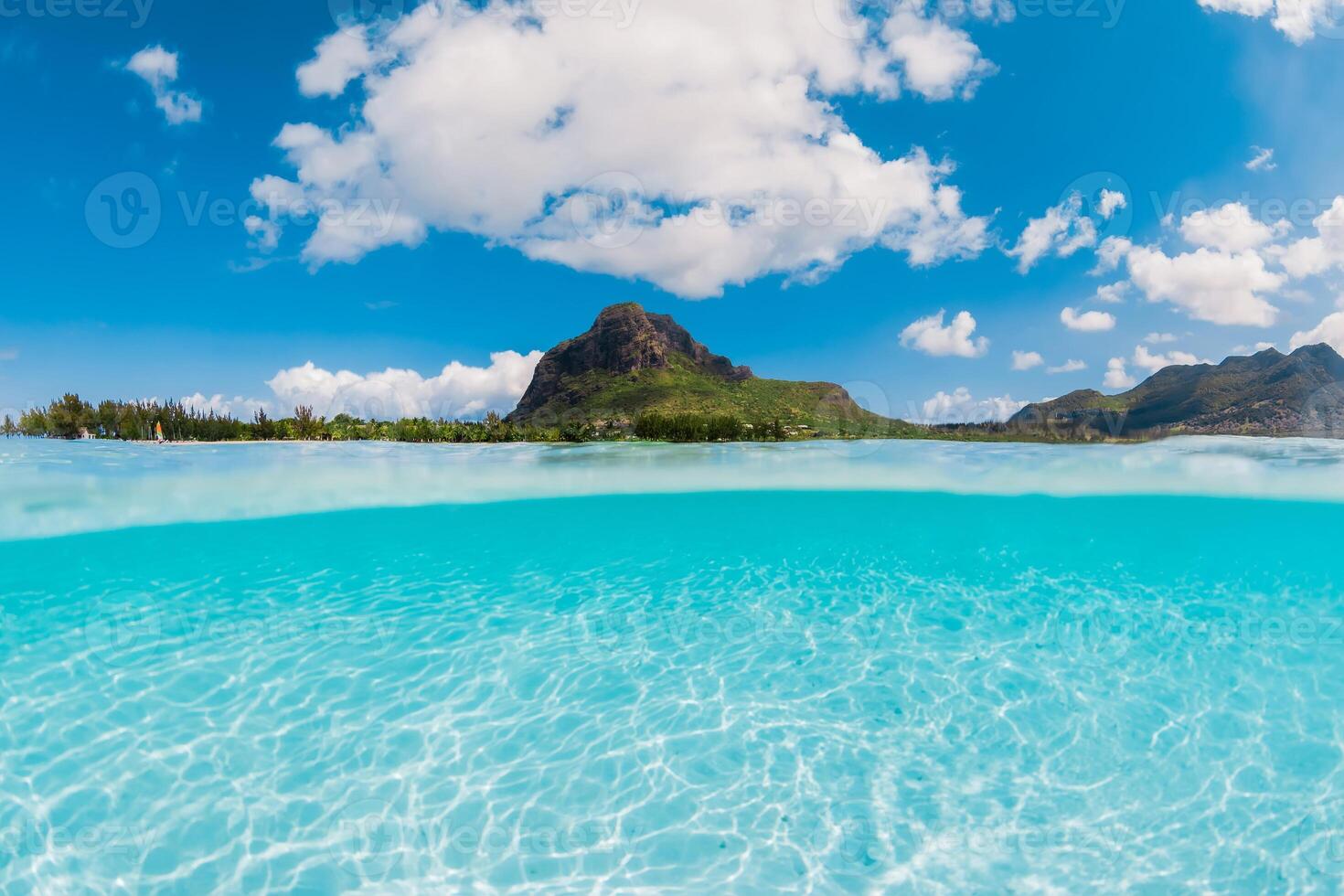 Ocean with transparent water and Le Morne mountain in Mauritius. Fifty fifty view. photo
