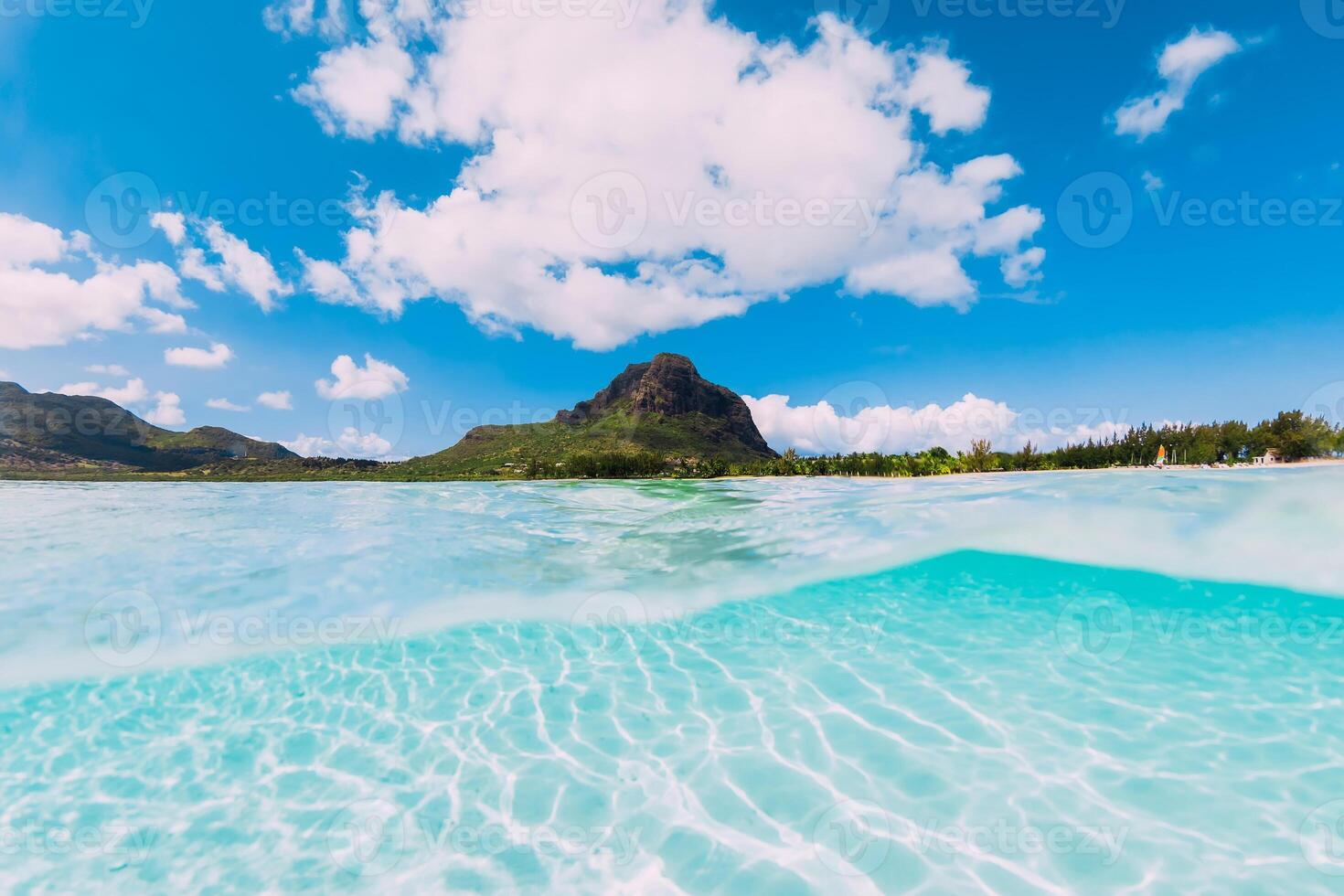 Tropical clear ocean with white sand near Le Morne mountain in Mauritius. photo