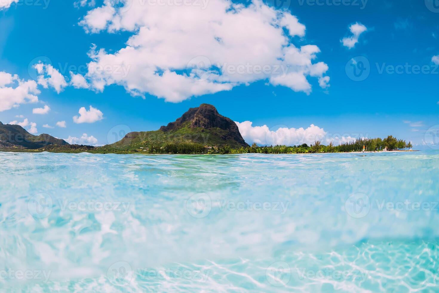 Tropical ocean with water and Le Morne mountain at background in Mauritius. photo