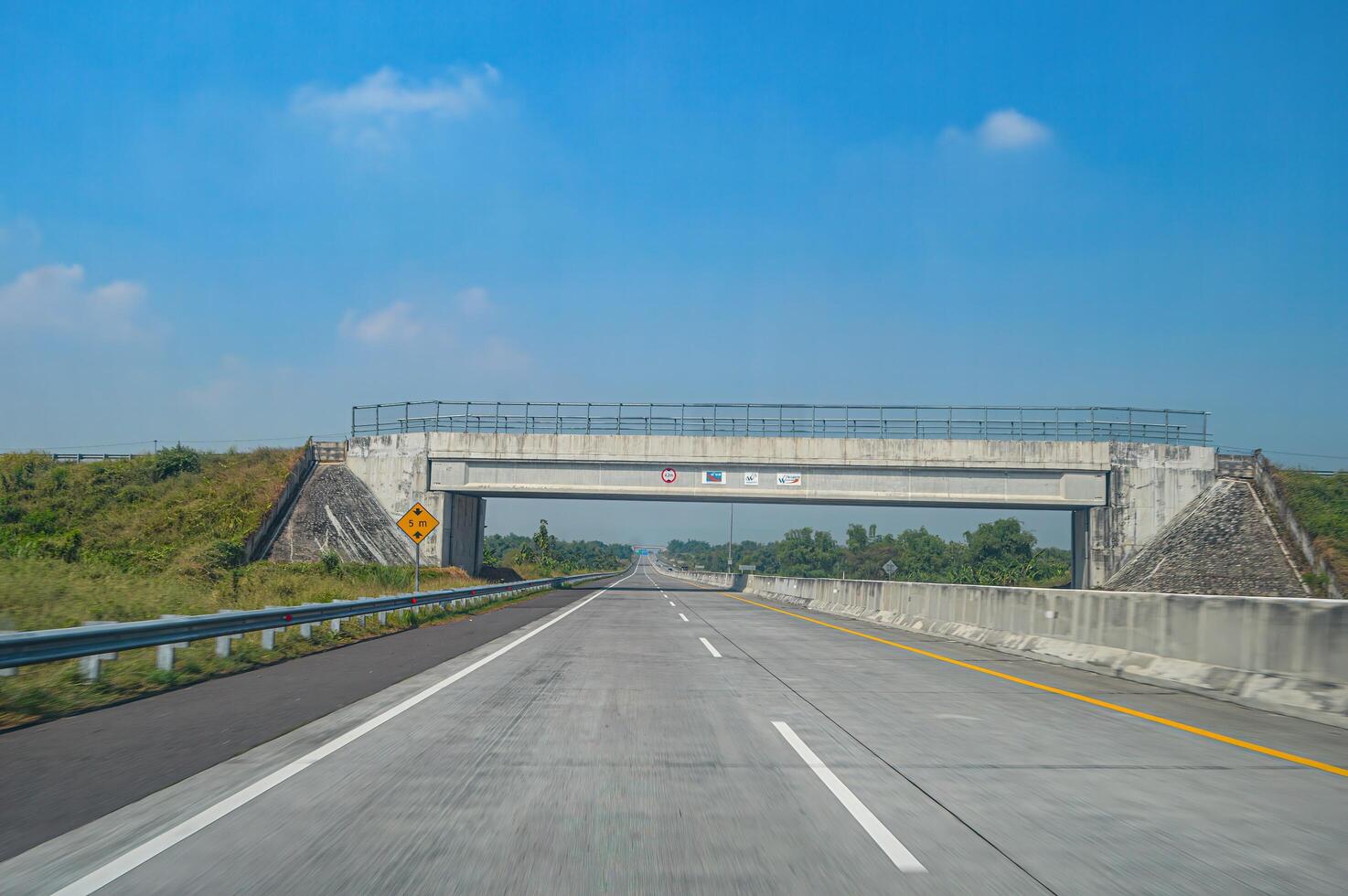 the atmosphere of toll roads in Indonesia is quiet. toll road flyover bridge in Gresik photo