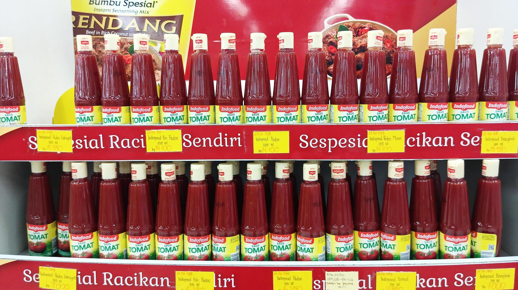 Semarang, Indonesia - May, 2024 - Bottled sauce is sold in a display case, product display case in a supermarket photo