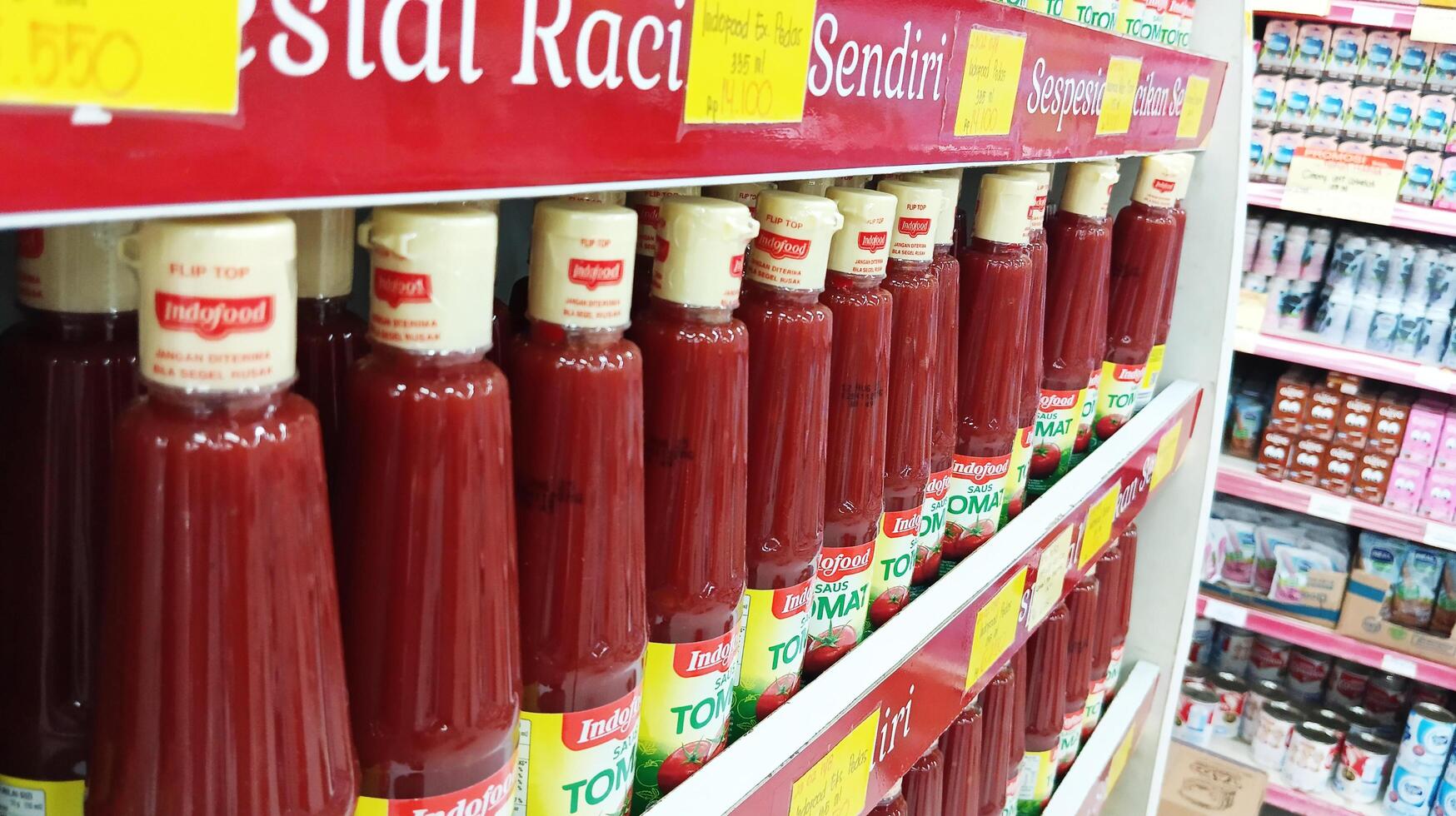 Semarang, Indonesia - May, 2024 - Bottled sauce is sold in a display case, product display case in a supermarket photo