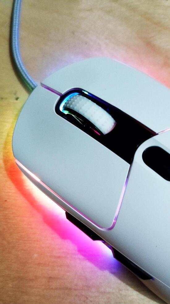 close up of a white computer mouse that lights up photo