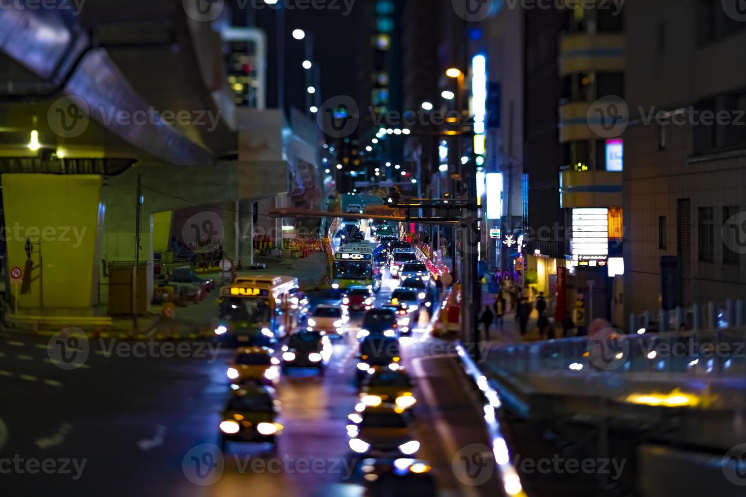A night miniature neon street in Shibuya Tokyo tiltshift photo