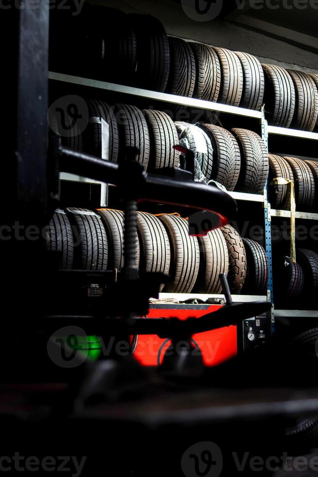 Garage. Car repair. Tools. Rubber tires, wheels. photo