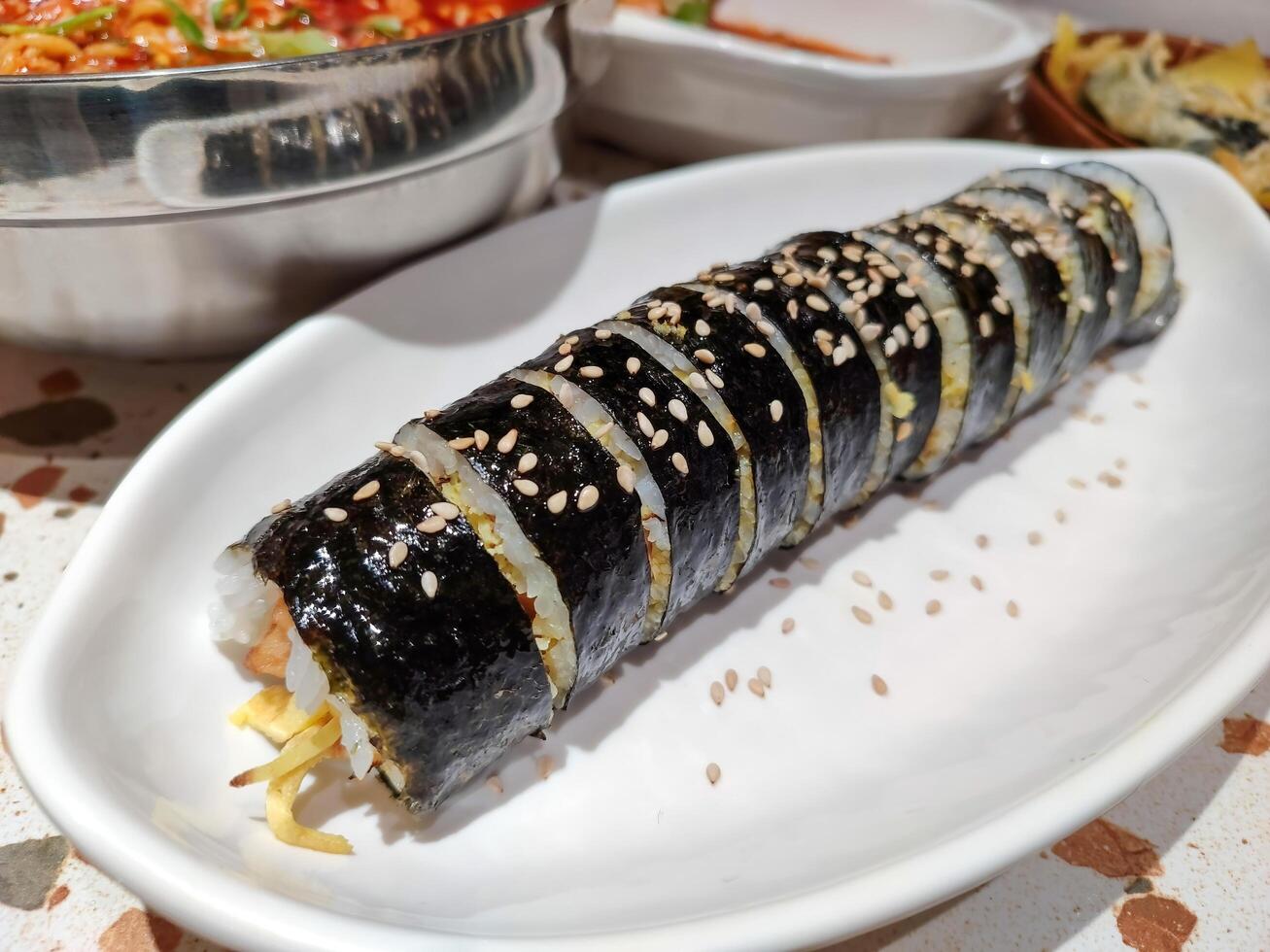a plate of kimbap roll or sushi roll. perfect for menu and food content photo