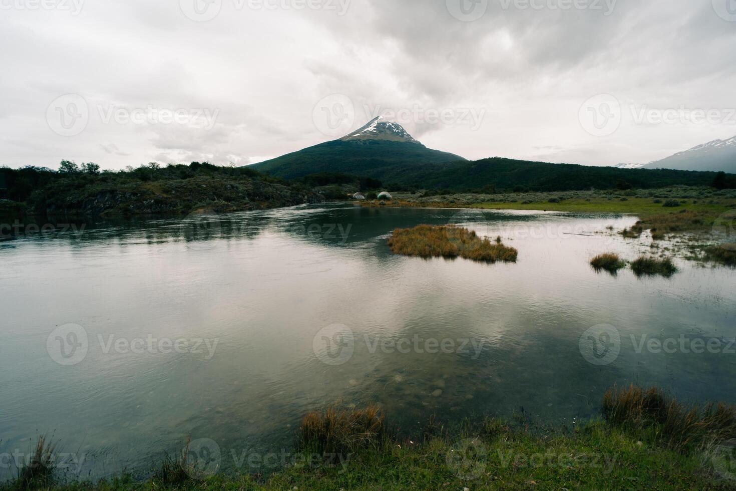 lake in Bahia Lapataia amidst mountains at Tierra del Fuego photo