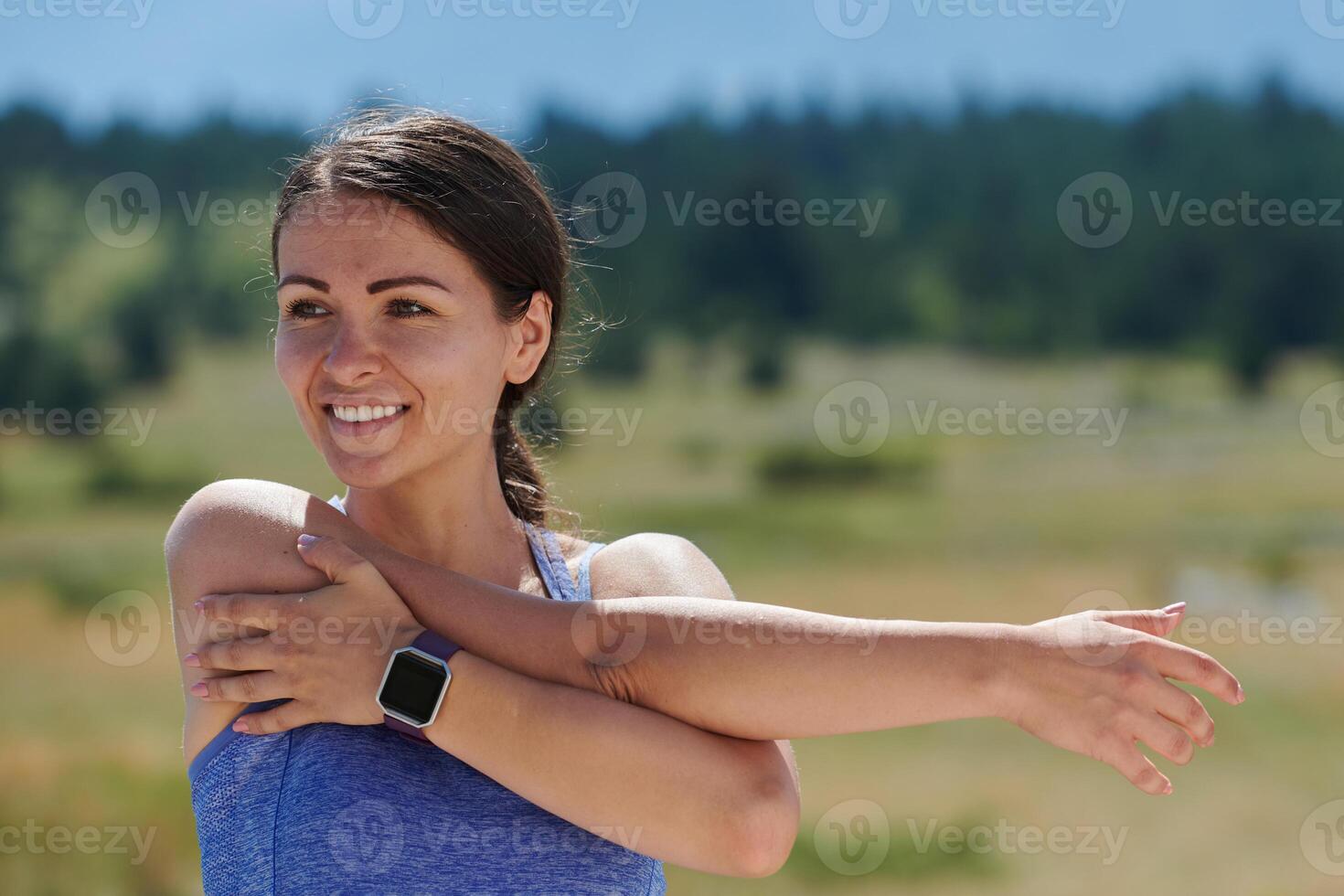 Determined Stretch. Athletic Woman Embraces Post-Run Flexibility in Nature. photo