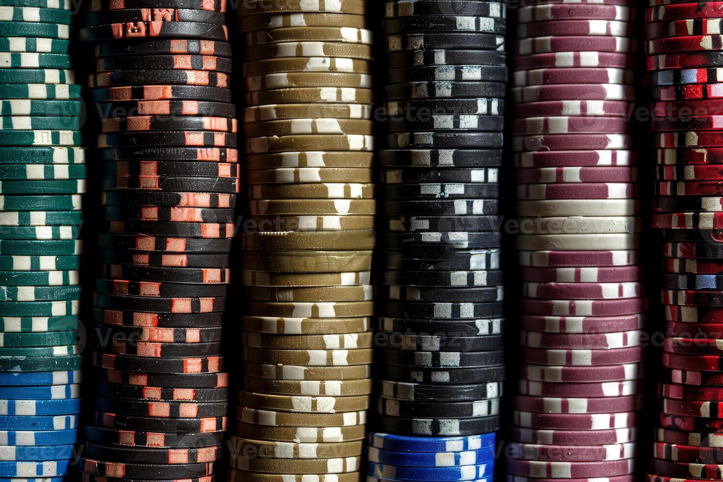A large number of multi-colored poker chips. Big wins and excitement of the game photo