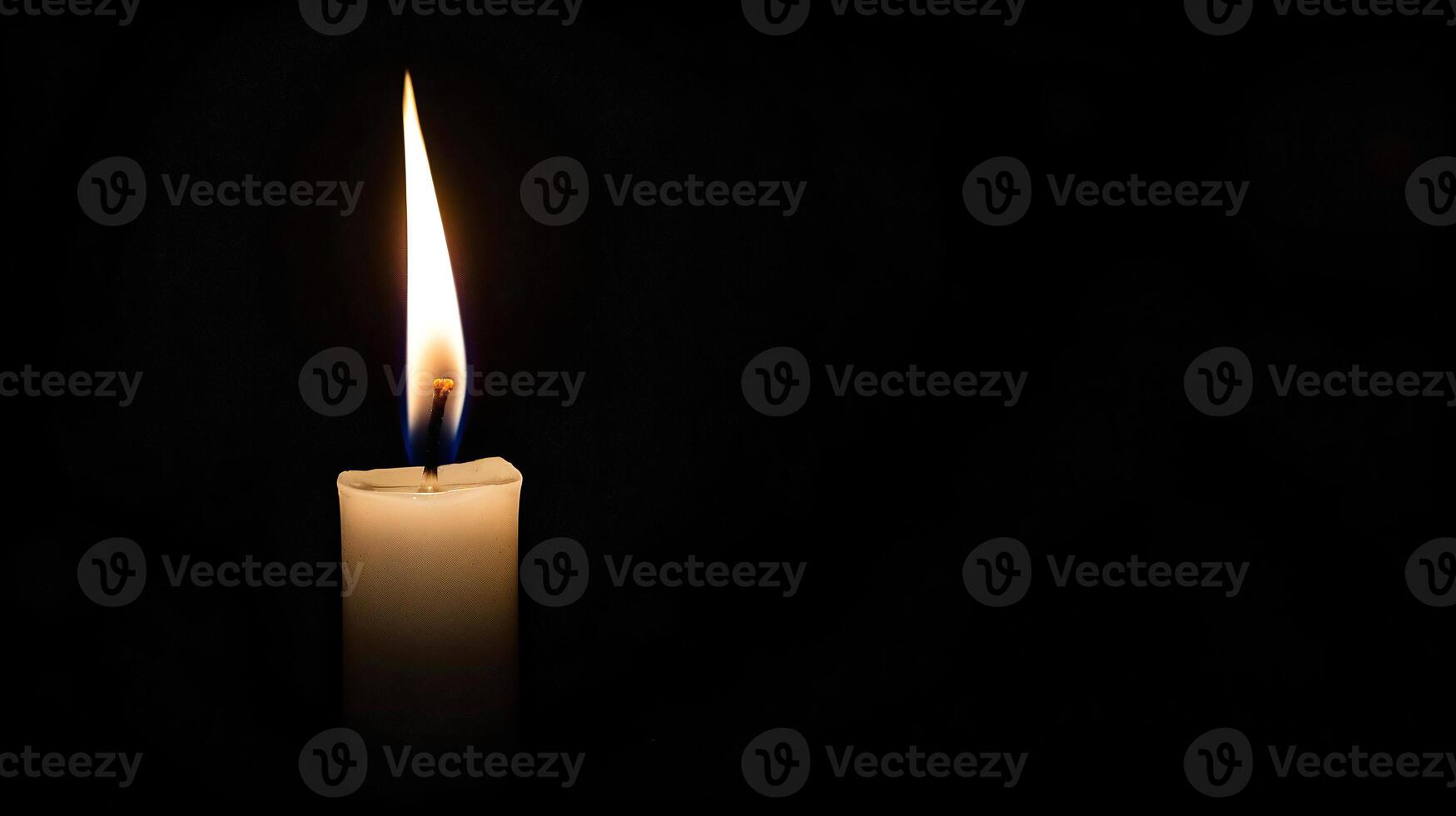 Burning white candle on black background. Close-up photo. With copy space. Image for memory of events and people photo