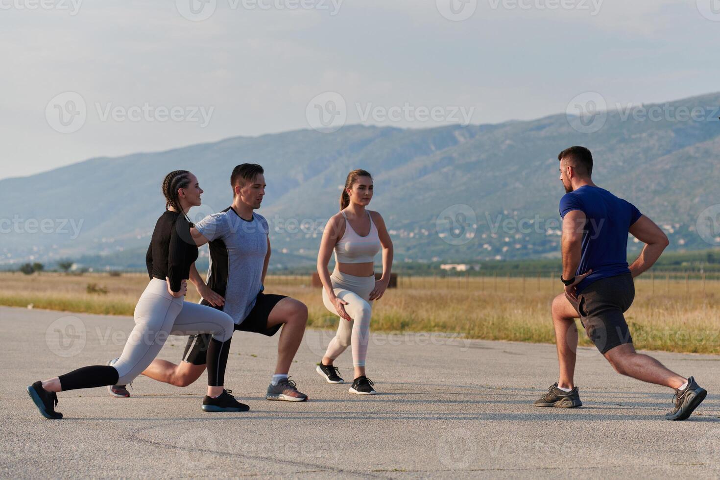 Diverse Group of Athletes Prepare Together for a Run photo