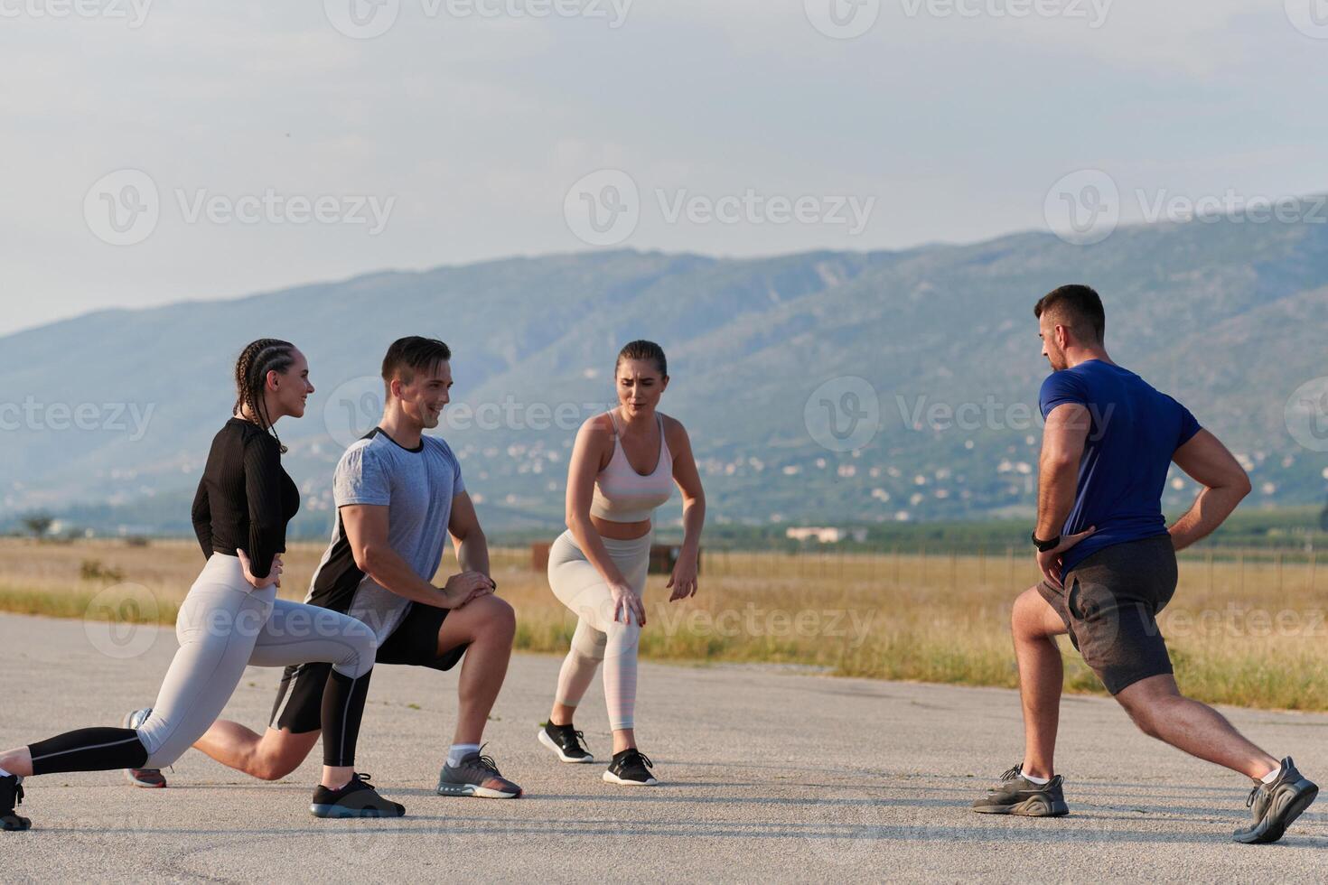 Diverse Group of Athletes Prepare Together for a Run photo