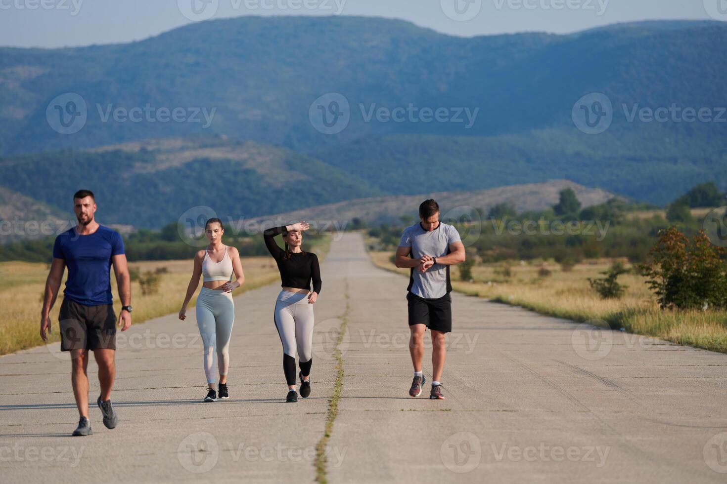 A group of friends maintains a healthy lifestyle by running outdoors on a sunny day, bonding over fitness and enjoying the energizing effects of exercise and nature photo