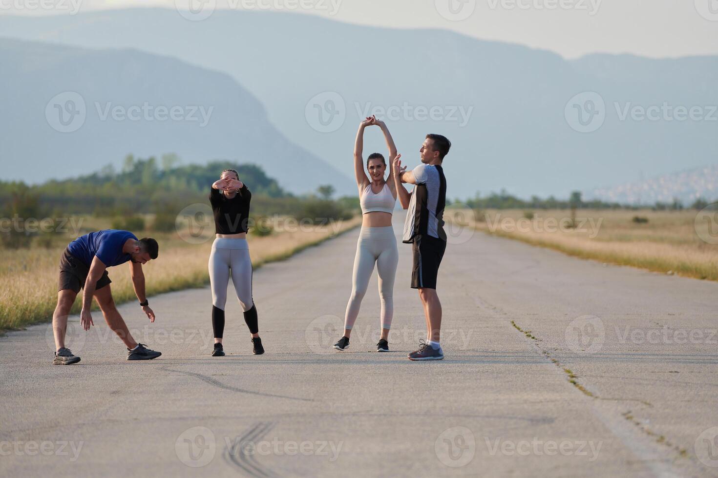 Diverse Group of Athletes Prepare Together for a Run photo