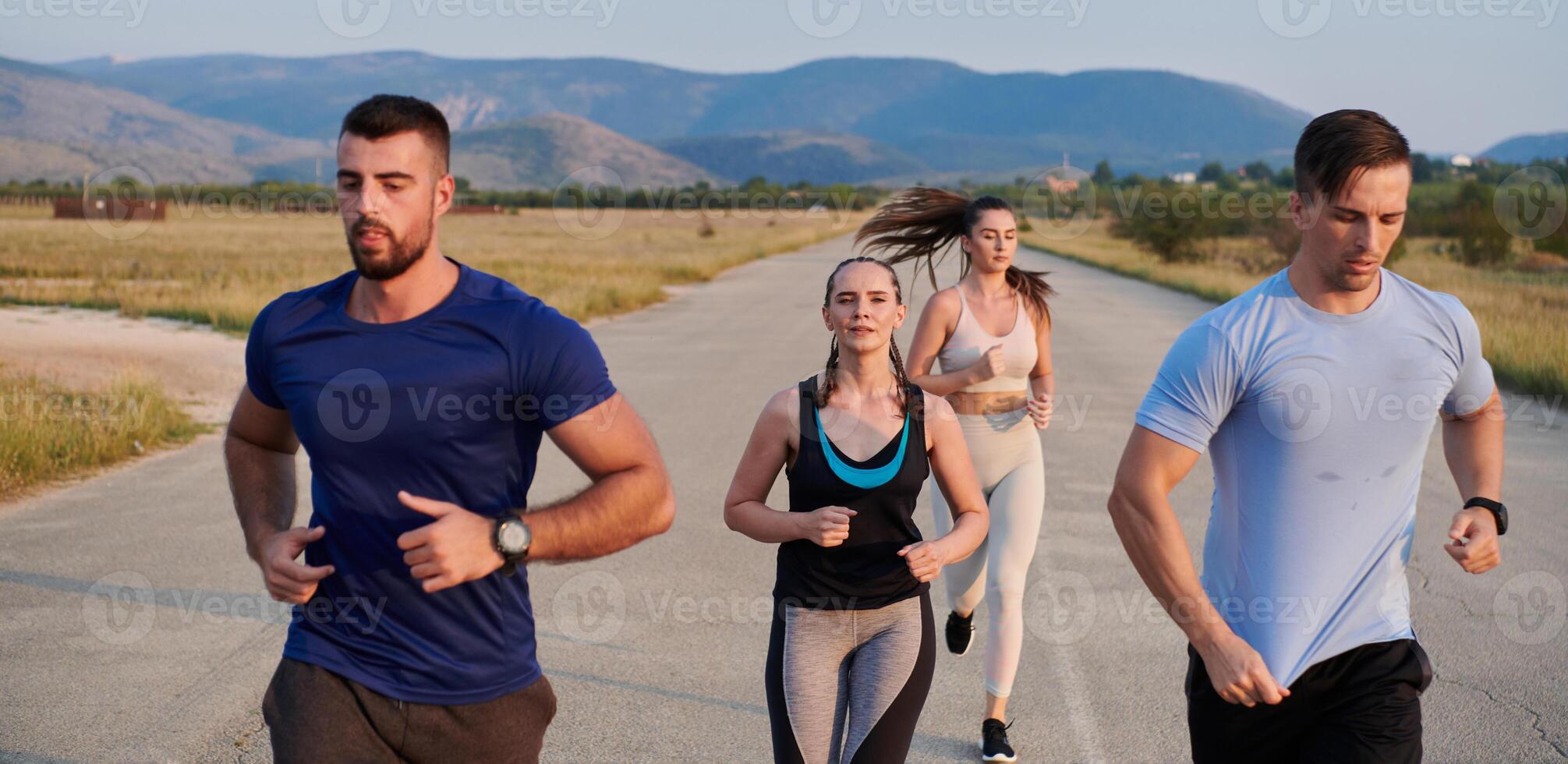 A group of friends maintains a healthy lifestyle by running outdoors on a sunny day, bonding over fitness and enjoying the energizing effects of exercise and nature photo