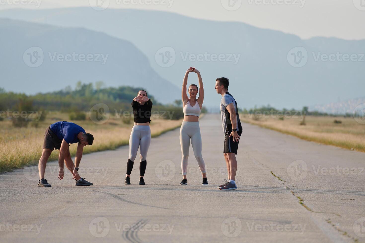 Diverse Group of Athletes Prepare Together for a Run photo