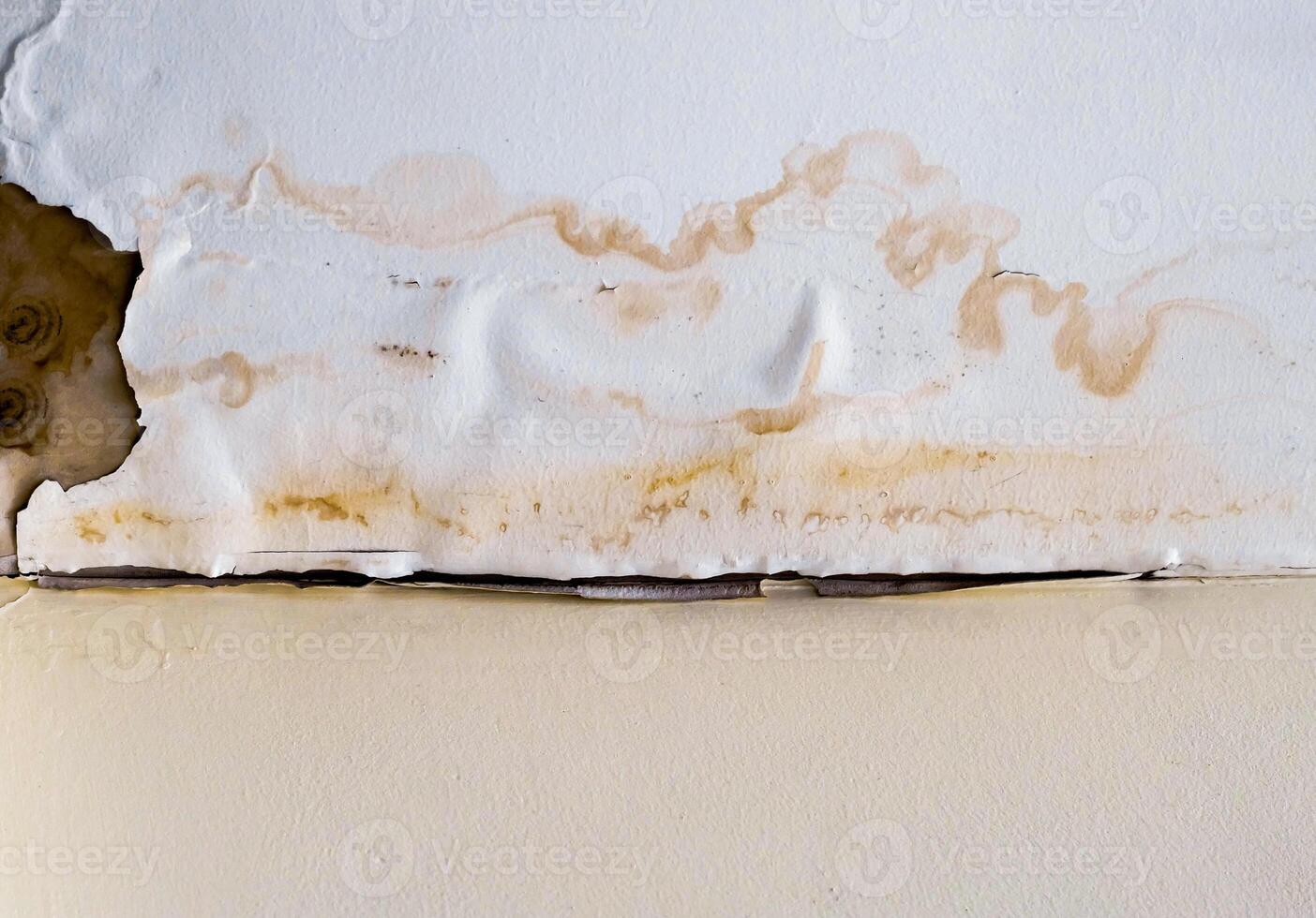 Water damaged ceiling roof in an old abandoned house. photo