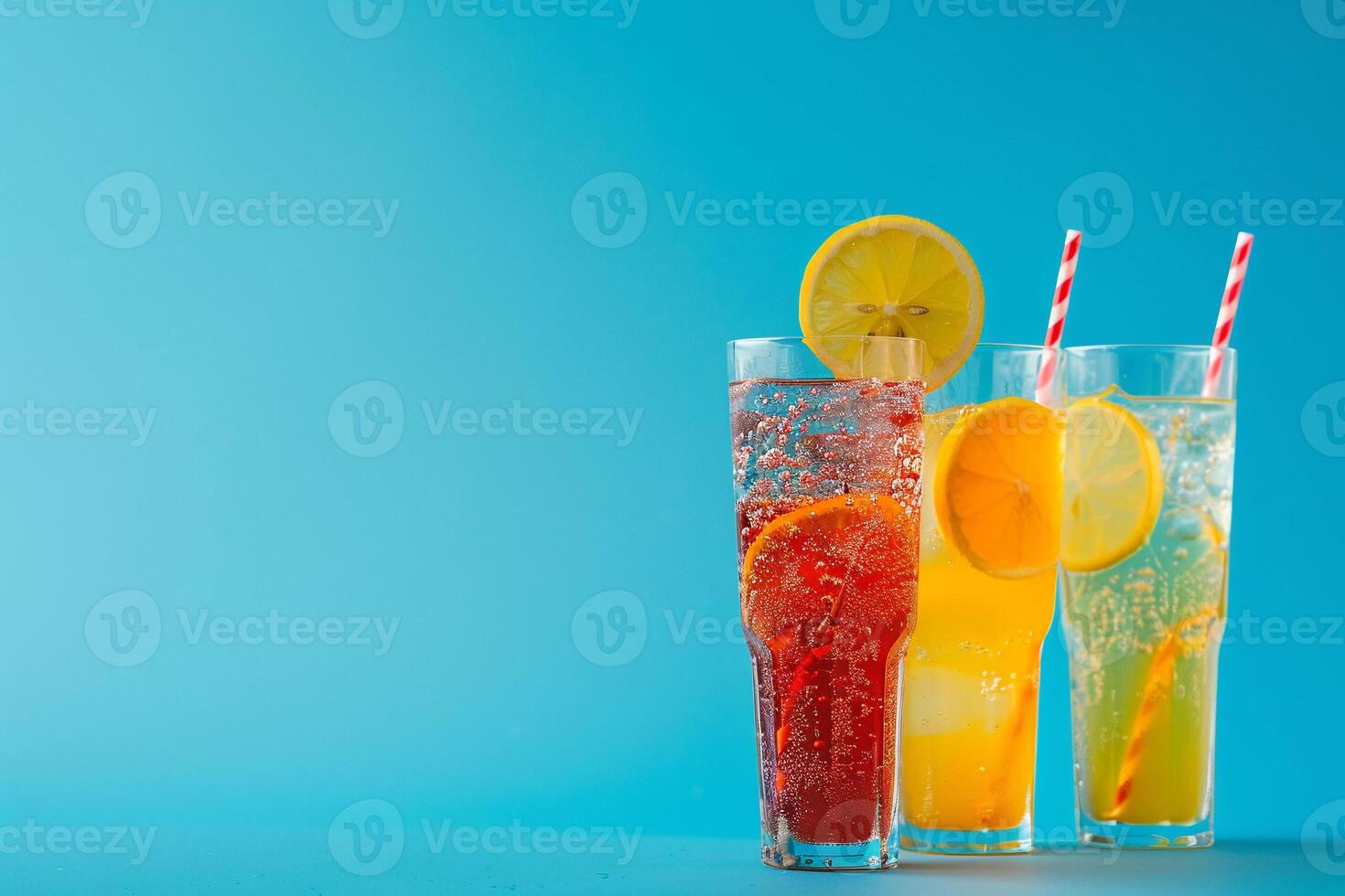 Cooling summer cocktails with berries and fruits on colored background photo