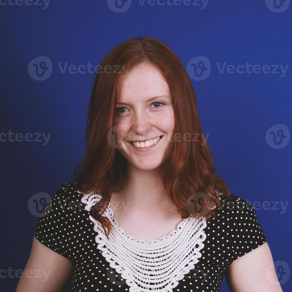 happy young woman with toothy smile photo