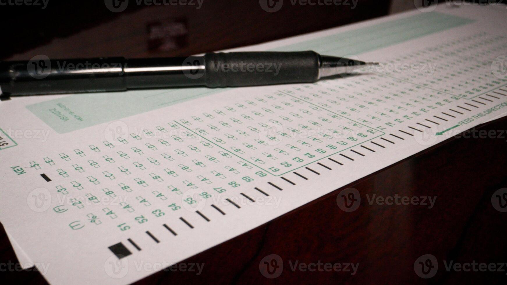 3 photo Hispanic male filling out multiple choice exam student testing paper