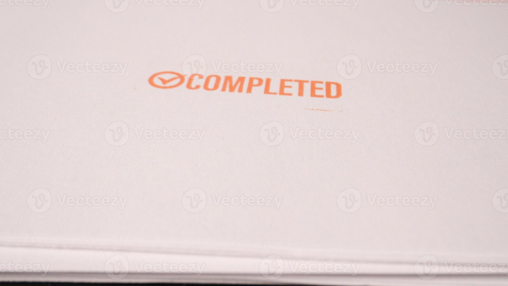 12 photo of orange stamp inscription completed done finished concept on paper