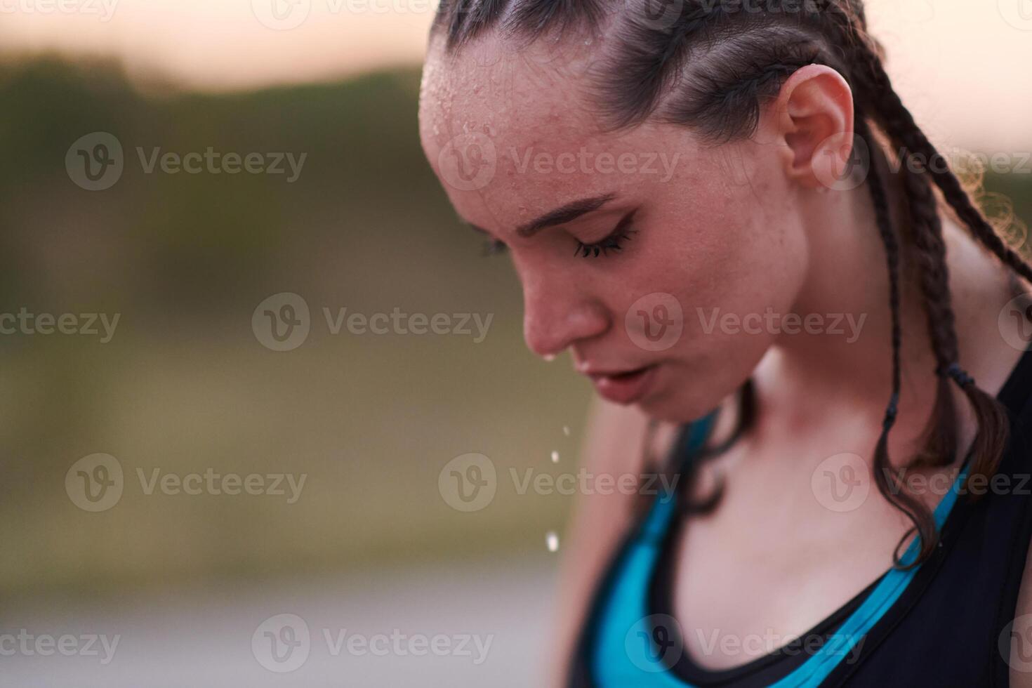 Close-Up Portrait of Determined Athlete Resting After Intense Workout photo