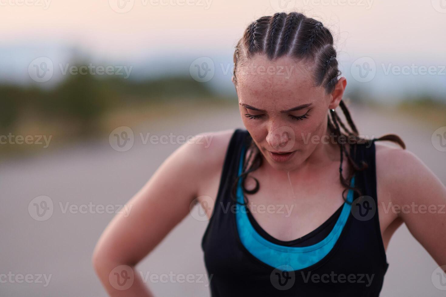 Close-Up Portrait of Determined Athlete Resting After Intense Workout photo