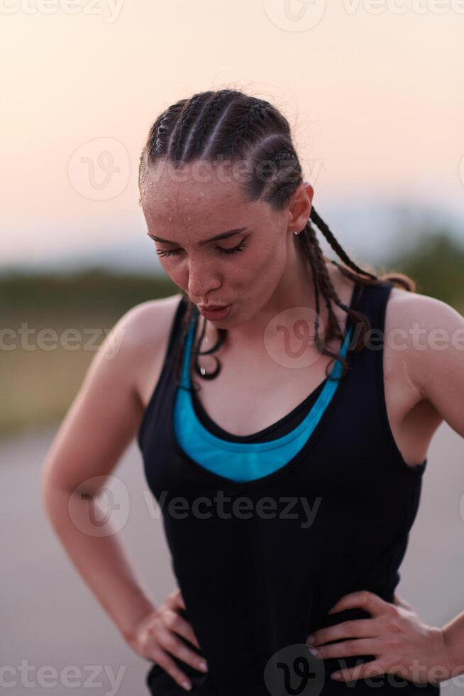 Close-Up Portrait of Determined Athlete Resting After Intense Workout photo