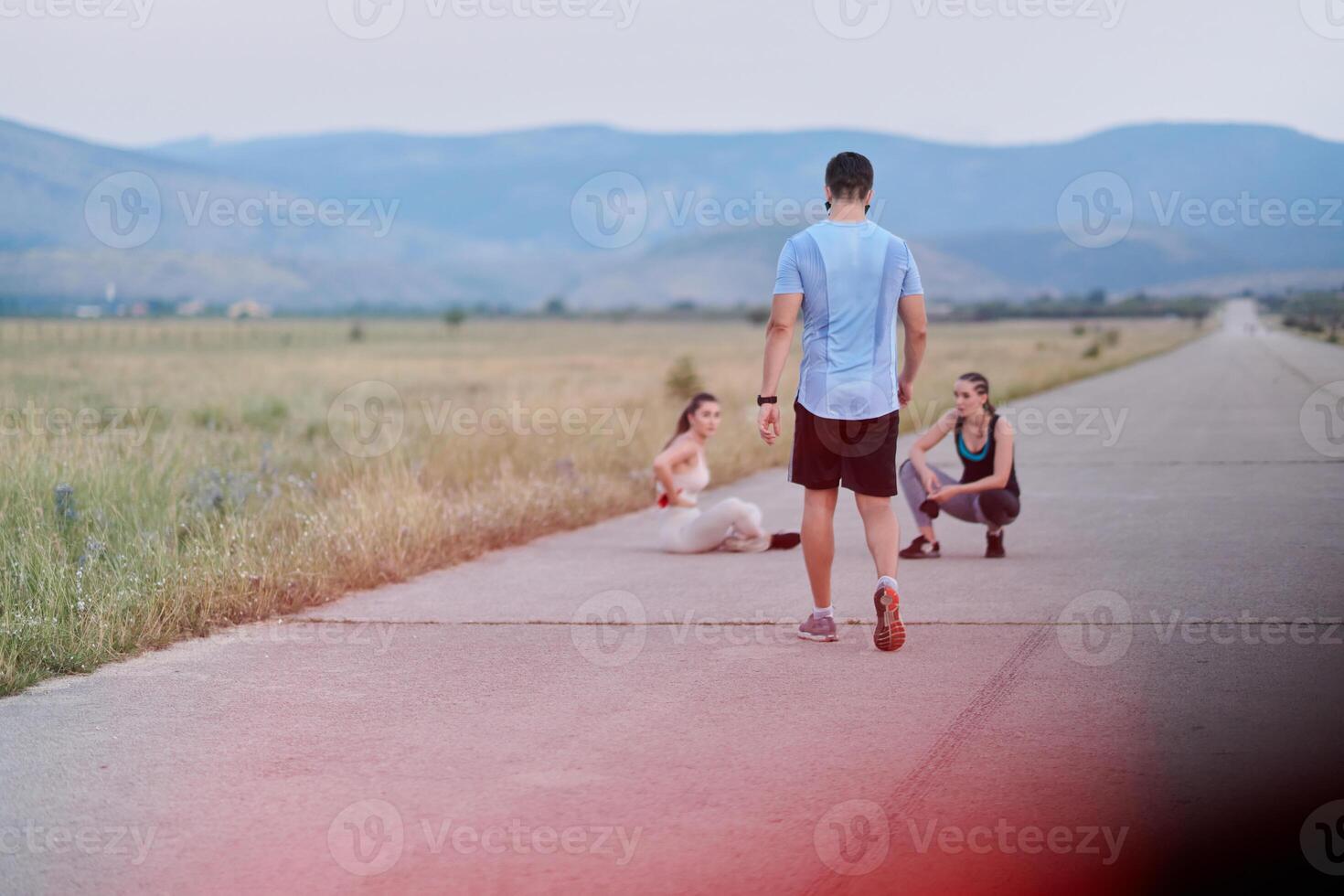 Diverse Athletic Warm-Up. Group Prepares for Intense Running Challenge. photo
