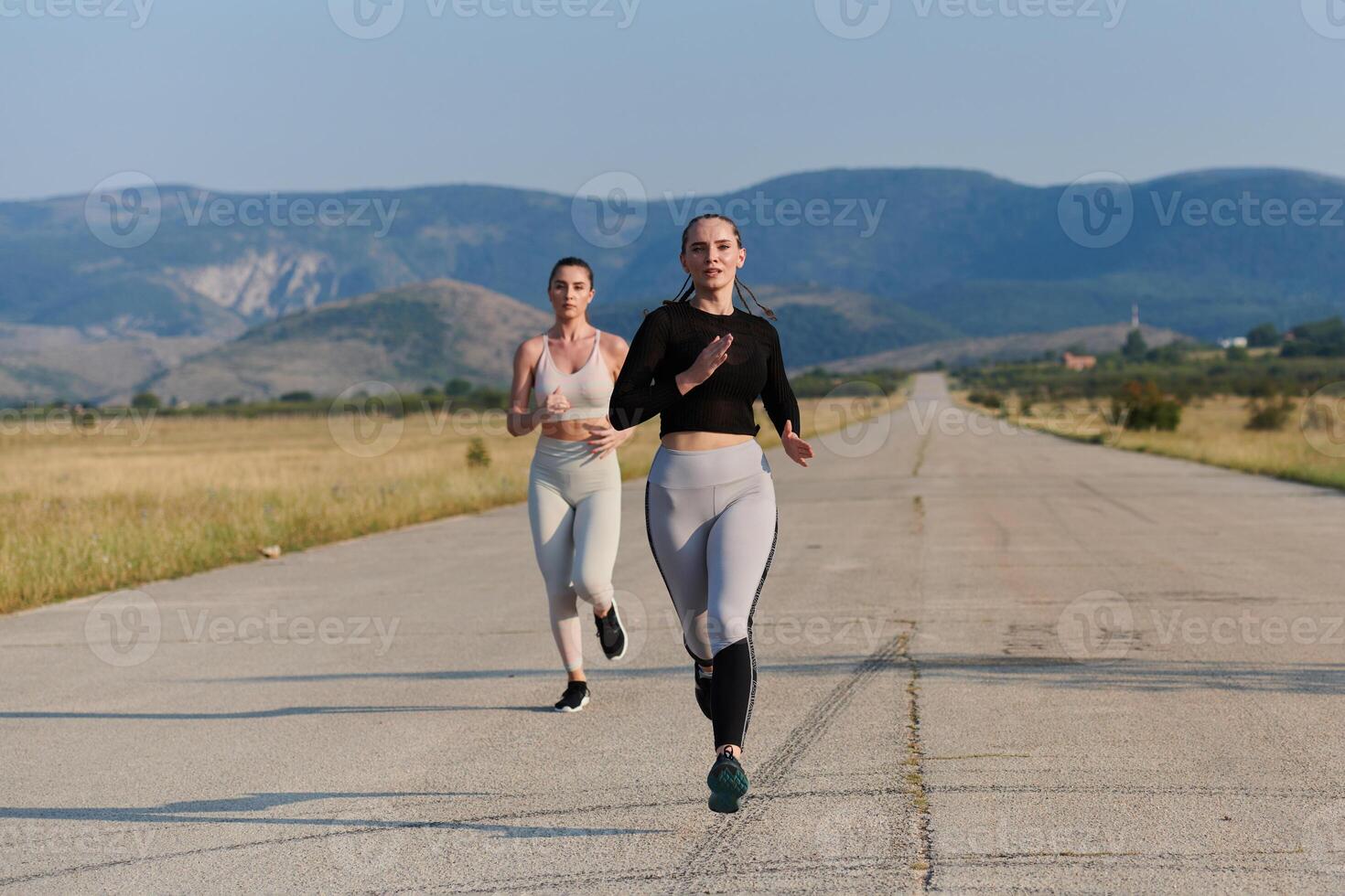 A group of friends maintains a healthy lifestyle by running outdoors on a sunny day, bonding over fitness and enjoying the energizing effects of exercise and nature photo