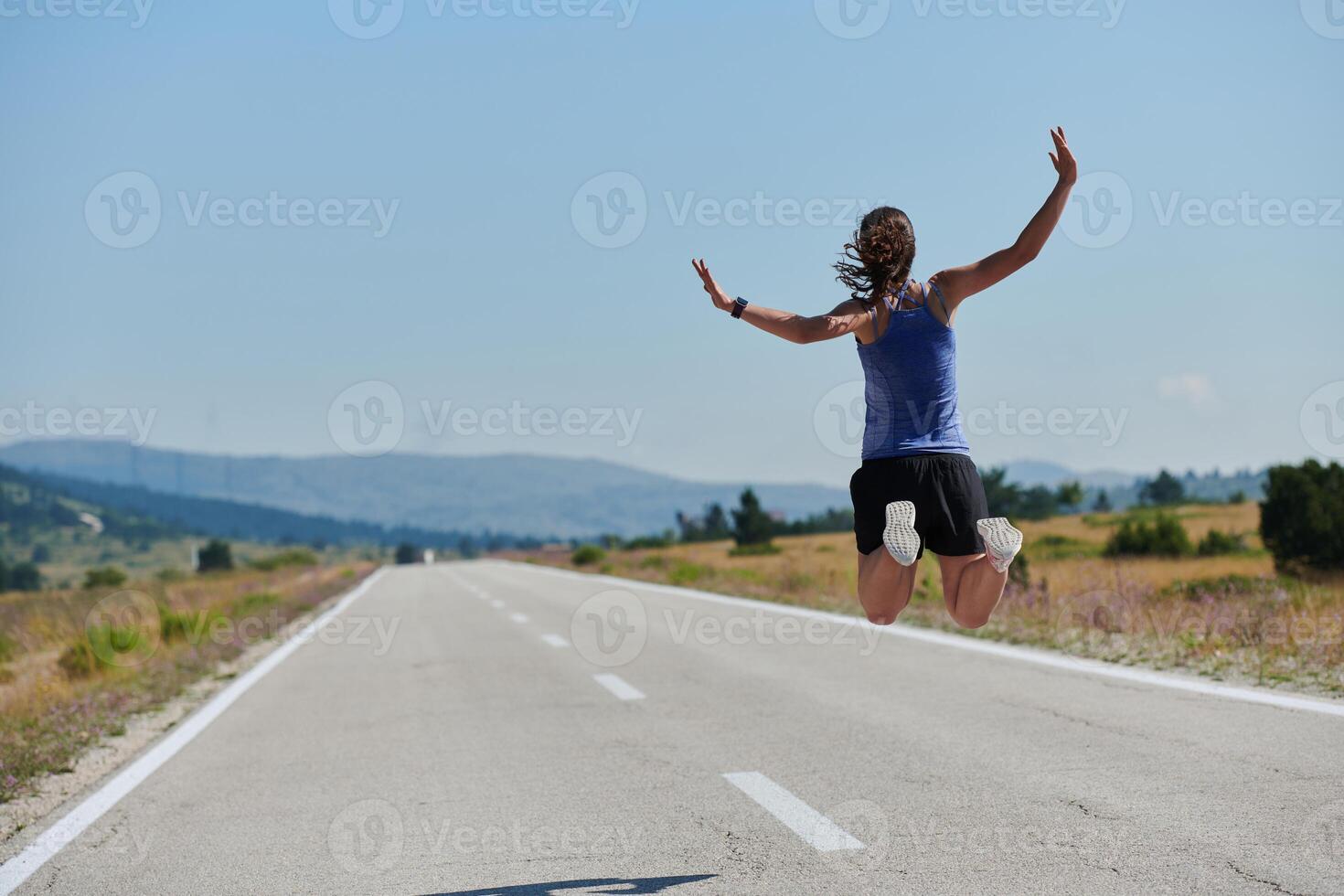 Leap of Victory. Athlete Symbolizes Success and Dedication Through Mid-Air Jump. photo