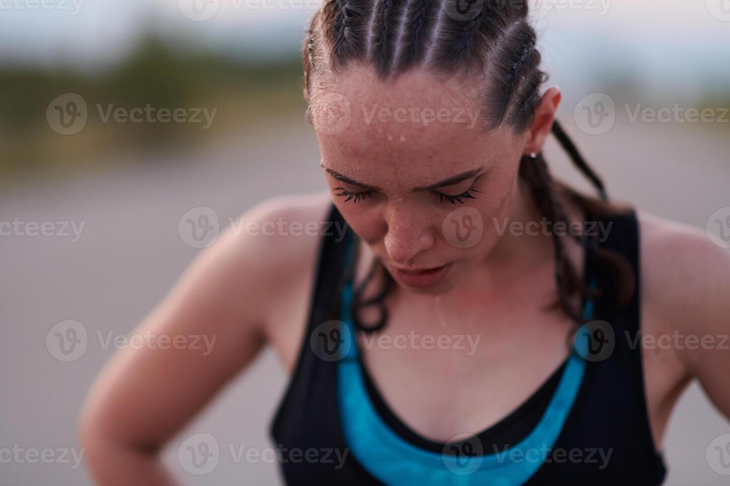 Close-Up Portrait of Determined Athlete Resting After Intense Workout photo