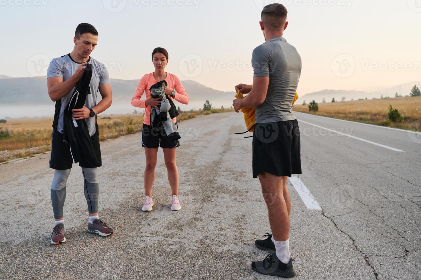 Morning Prep. Group of Athletes Getting Ready for a Run. photo