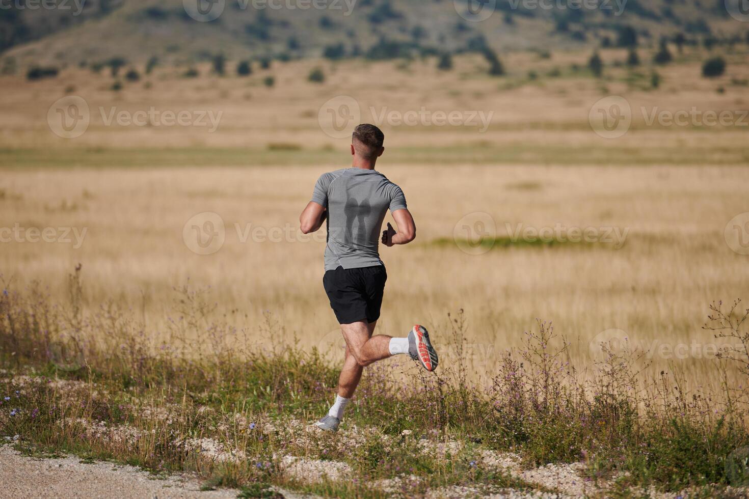 Determined Stride. Athletic Man Embarks on Marathon Preparation with Resolve. photo